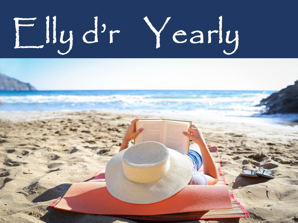 Een vrouw die op het strand een boek leest. Dat zou zomaar Elly kunnen zijn!